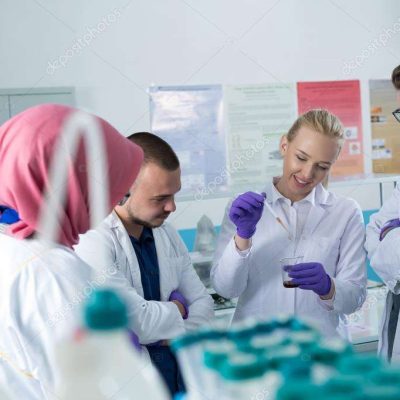 depositphotos_130016514-stock-photo-group-of-scientists-working-at